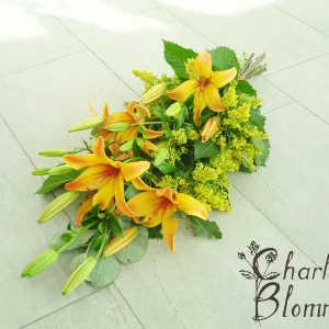 Sorgbukett i orange nyanser