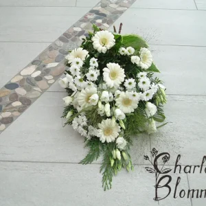 Sorgbukett med vita blommor