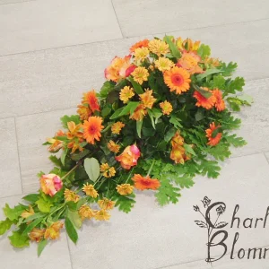 Sorgdekoration låg i orange nyanser