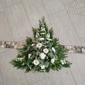 Sorgdekoration låg i vitt och grönt