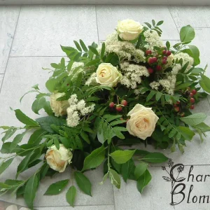 Sorgdekoration låg i vitt,grönt och natur